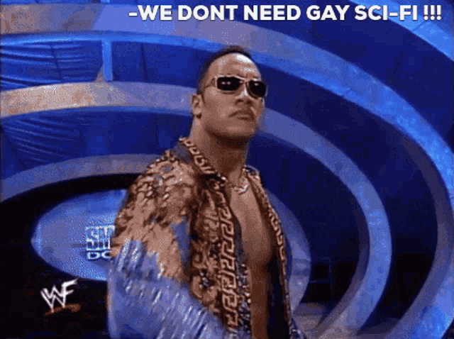 a man wearing sunglasses stands in front of a sign that says - we dont need gay sci-fi