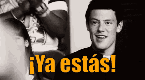 a black and white photo of a man with the words ya estas in yellow