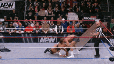 a wrestling ring that has a sign that says hook on it