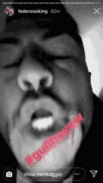 a black and white photo of a man 's face with a red sticker on his neck that says #guilty never