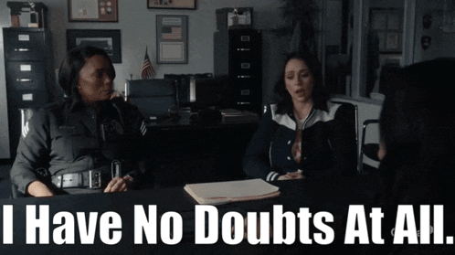 two police officers sit at a desk with the words " i have no doubts at all " above them