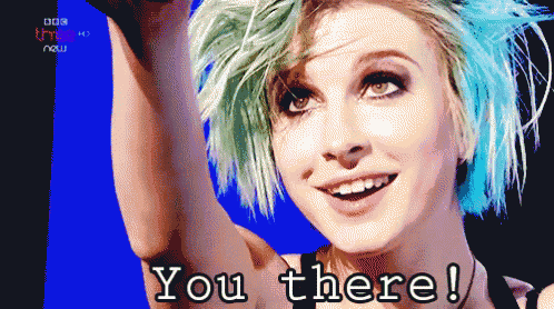 a woman with green hair says you there