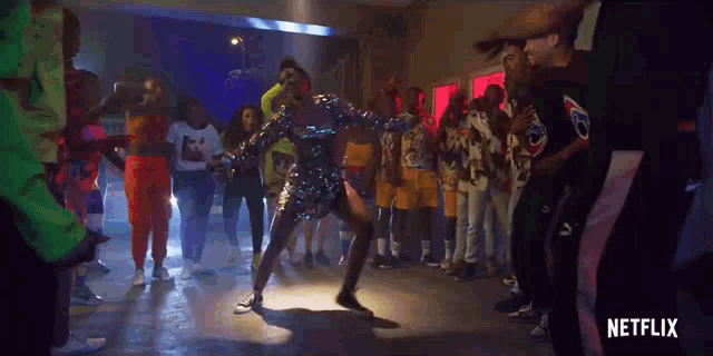 a group of people are dancing in a room with a netflix logo on the bottom