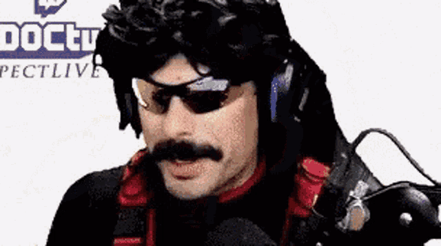 a man with a mustache and sunglasses is wearing headphones .