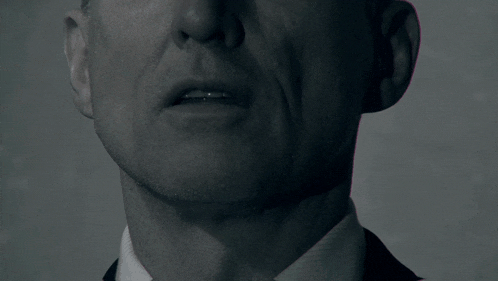 a close up of a man 's face with the word ustach in white