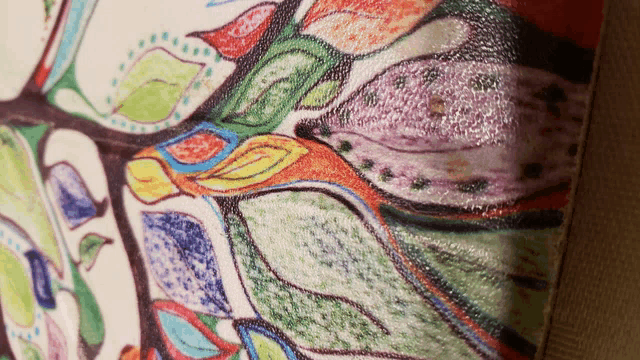 a colorful painting of a tree with leaves and flowers