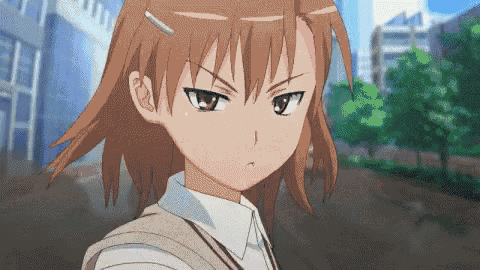 a girl with brown hair and a white shirt looks angry