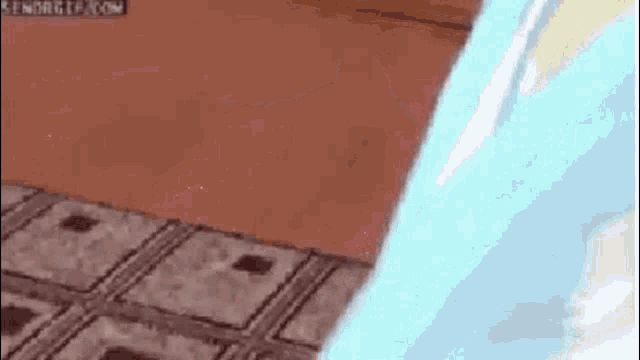 a cat is peeking out from behind a blue blanket on a rug .