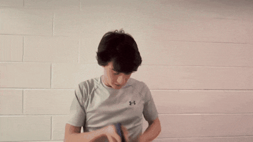 a blurry picture of a person 's face with a white wall in the background
