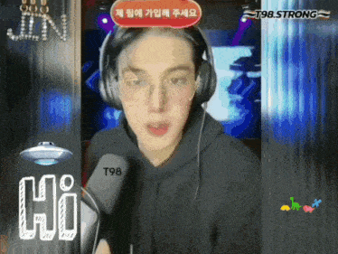 a man wearing headphones and glasses says hi in a video