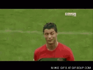 a soccer player with the number 7 on his jersey stands on the field