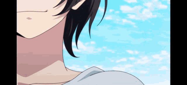 a close up of a person 's face with a blue sky in the background