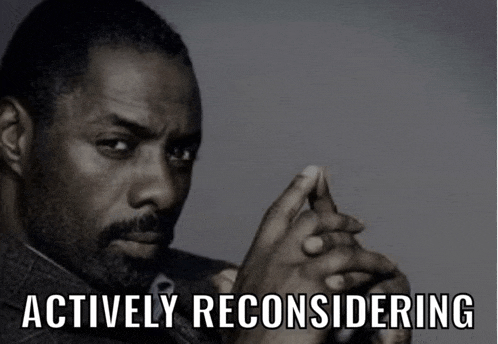 a man with his hands folded and the words actively reconsidering below him
