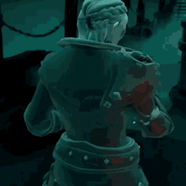 a statue of a woman in a video game is standing in the dark .