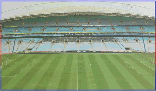 an empty soccer field with a blue and red border around it