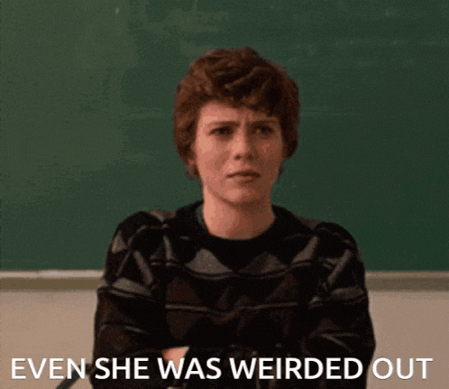 a woman sitting in front of a blackboard with the words even she was weirded out