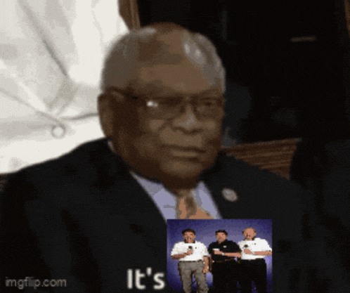 a man in a suit and tie has a picture of three men behind him and the words it 's on the bottom