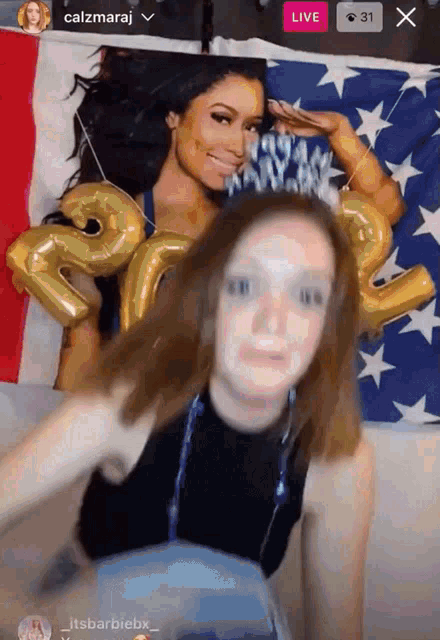 a woman wearing a headband with the number 32 on it stands in front of an american flag
