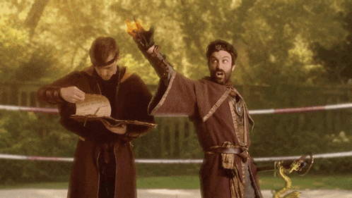 a man in a wizard costume is holding a torch in his hand
