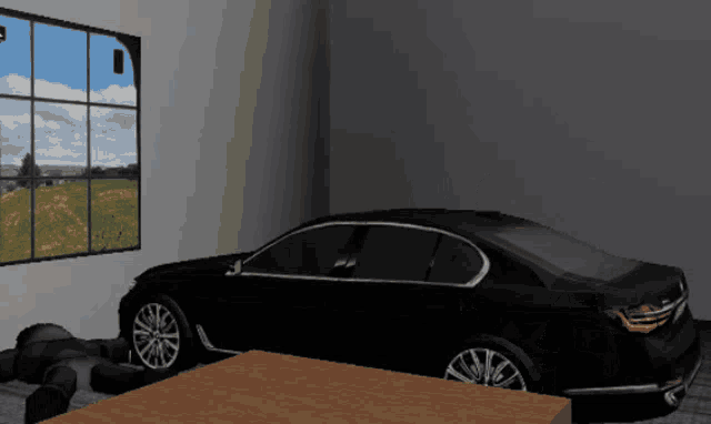 a black car is parked in a dark room