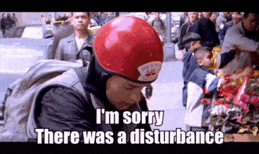 a man wearing a red helmet with joe 's pizza on it