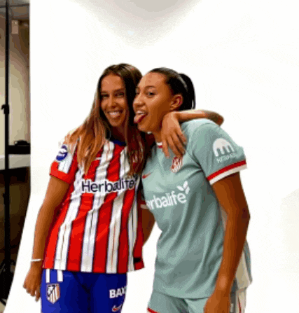 a woman wearing a red and white striped shirt that says herbalife