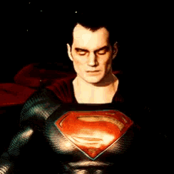 a close up of a man in a superman costume