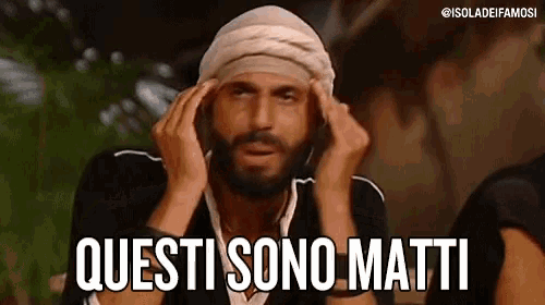 a man with a bandage on his head is holding his hands to his head and saying `` questi sono matti '' .