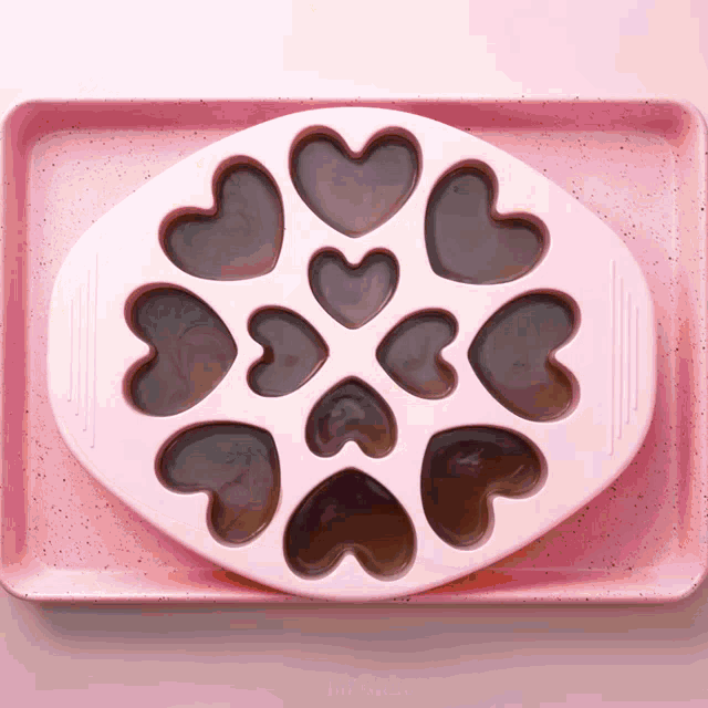 a pink tray with hearts on it that says mr.cakes