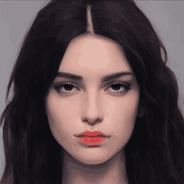 a close up of a woman 's face with red lipstick