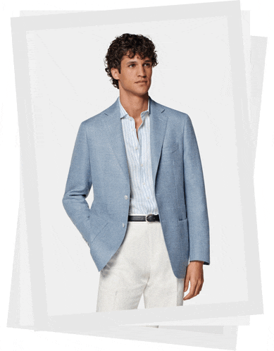 a man in a blue jacket and white pants
