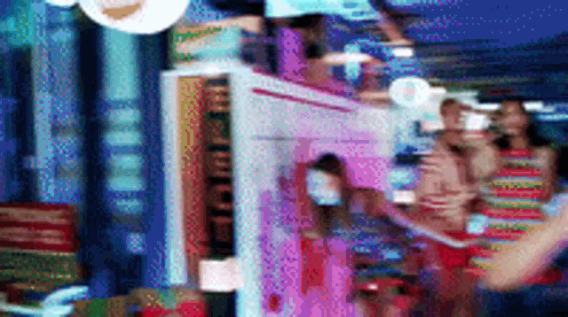 a blurry picture of people in a room with a sign that says ' hotel '