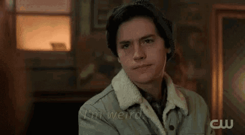 a man wearing a hat and a jacket is saying `` i 'm a weirdo . ''
