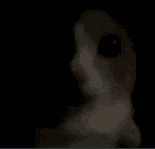 a close up of a person 's face in the dark with a black eye .
