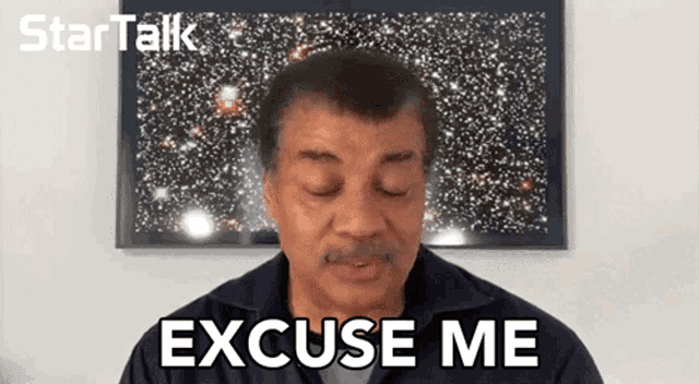 a man with his eyes closed is saying excuse me in front of a picture of stars .