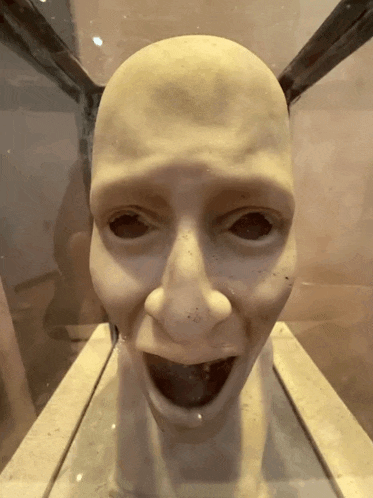 a statue of a man 's head with his mouth wide open