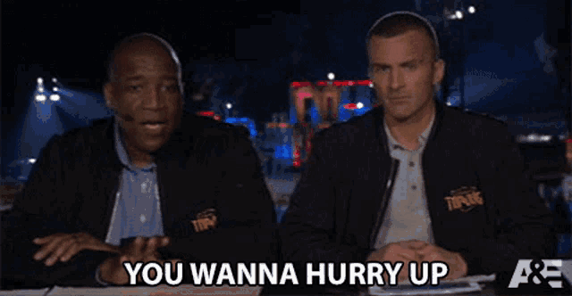 two men sitting at a table with the words you wanna hurry up