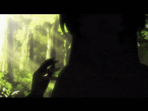 a person 's hand is reaching out towards a glowing object in the dark