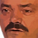 a close up of a man 's face with a mustache and a surprised look on his face .