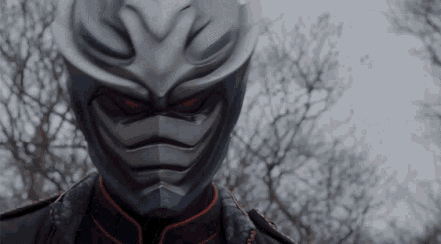 a close up of a person wearing a mask
