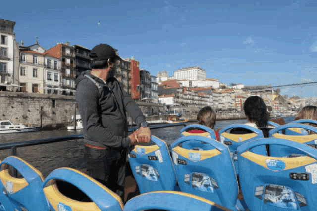 a man on a boat with a sticker on the back of his seat that says ' a ' on it