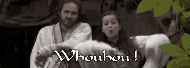 a man and a woman are standing next to each other with the words whouhou on the bottom right