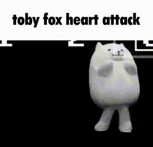 a stuffed animal is laying on its back on a black background with the words `` toby fox heart attack '' written above it .