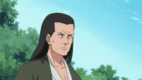a man with long hair and a white shirt is looking at the camera