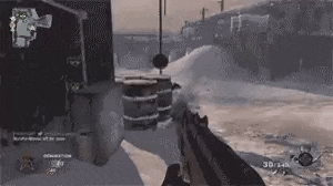 a person is holding a gun in a video game while playing a video game in the snow .