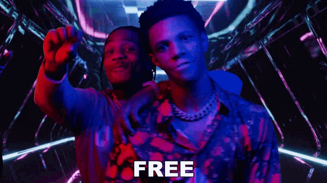 two men are standing next to each other and the word free is on the bottom
