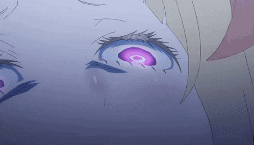 a close up of a person 's eye with a purple circle in it