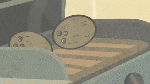 a cartoon drawing of two brown circles with holes in them on a wooden surface