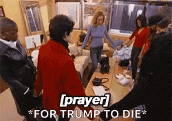 a group of people are holding hands in a circle in a living room with the words `` prayer for trump to die '' above them .