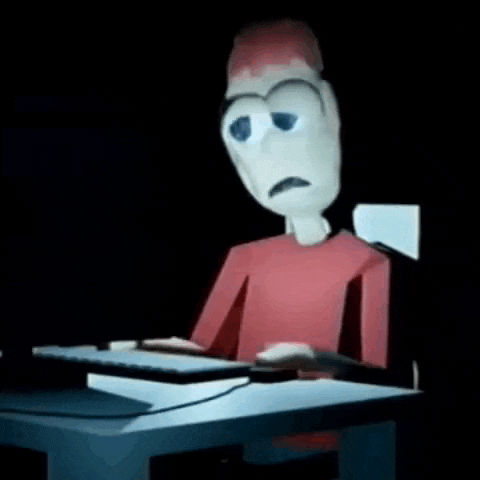 a cartoon character is sitting at a desk with a computer keyboard .